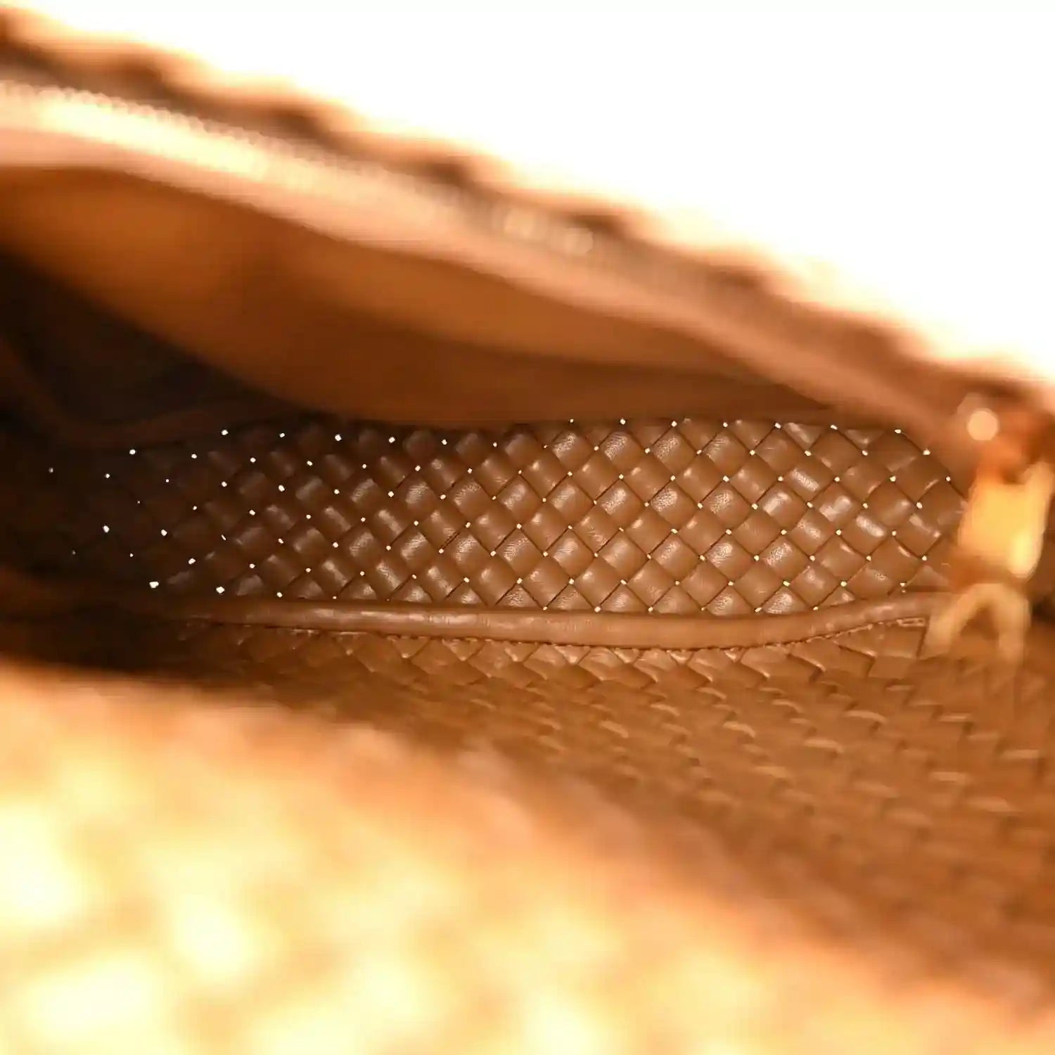 Caramel woven leather bag interior lining with cobble intreccio trim and stitched edge