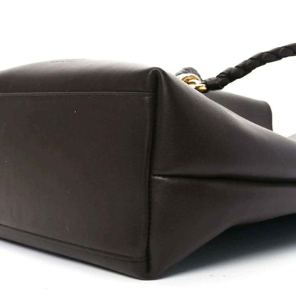 Small bucket bag side corner in dark leather with gold-tone strap hardware