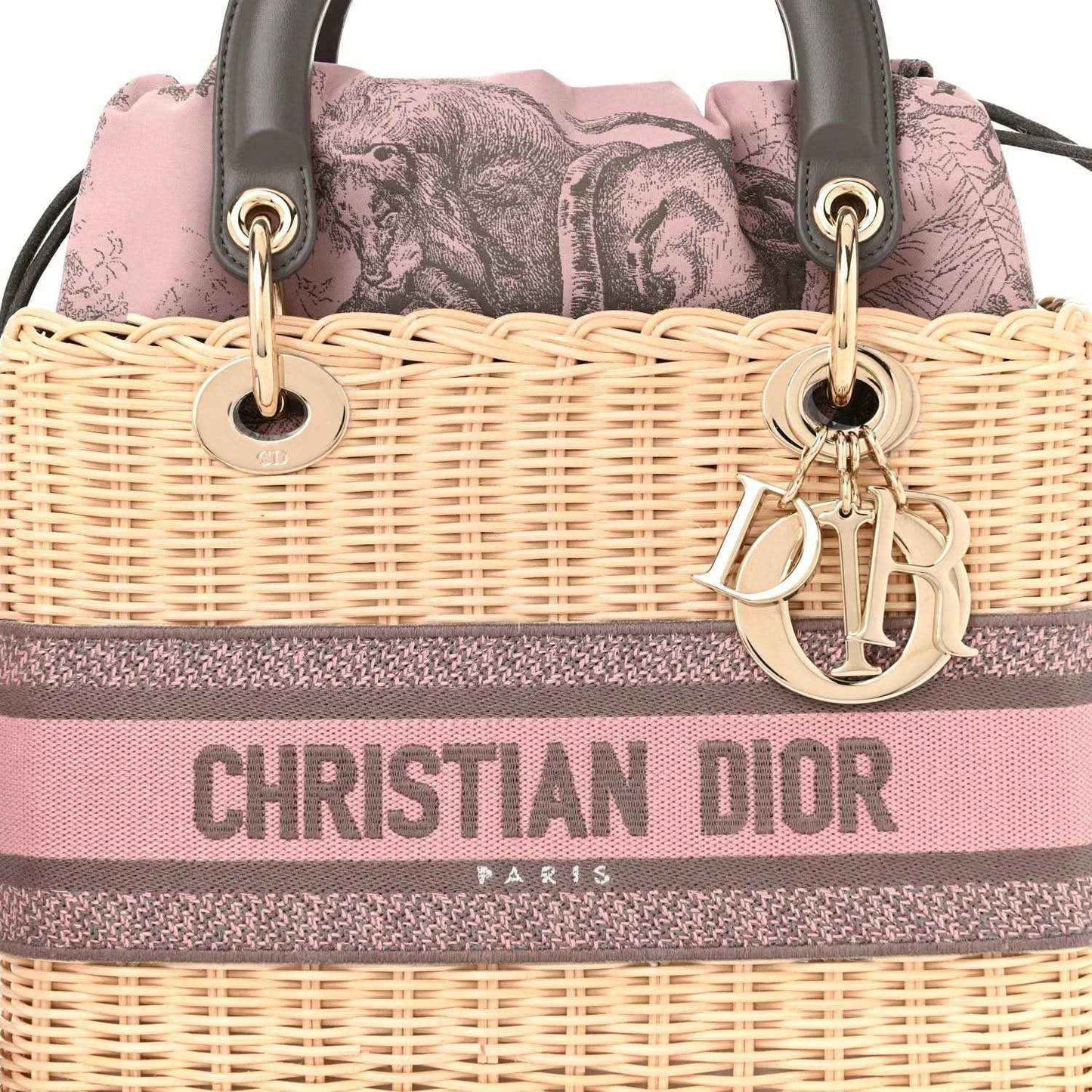 Wicker Lady Dior bag front with pink/gray stripe, gold Dior hardware and handles