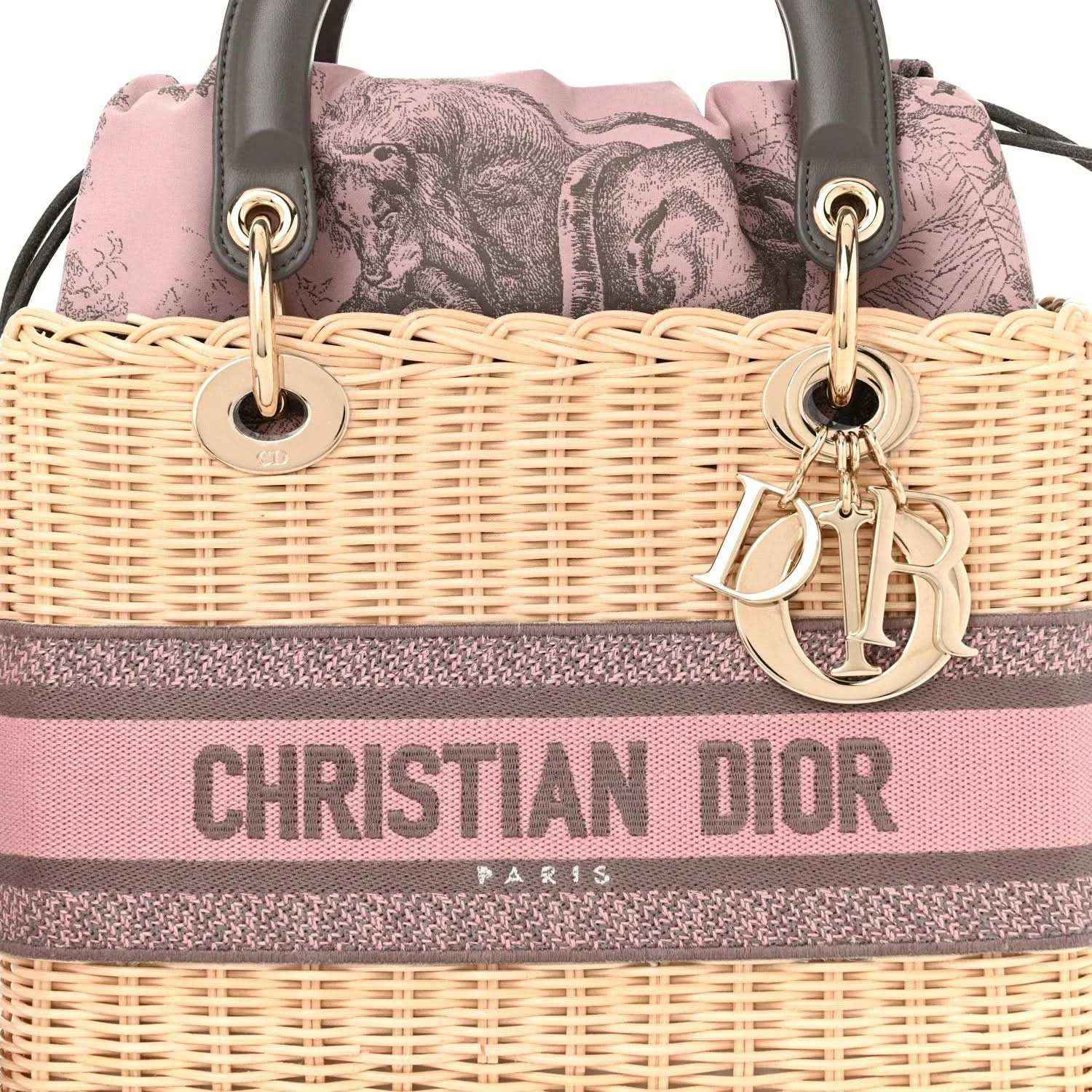Wicker Lady Dior bag front with pink/gray stripe, gold Dior hardware and handles