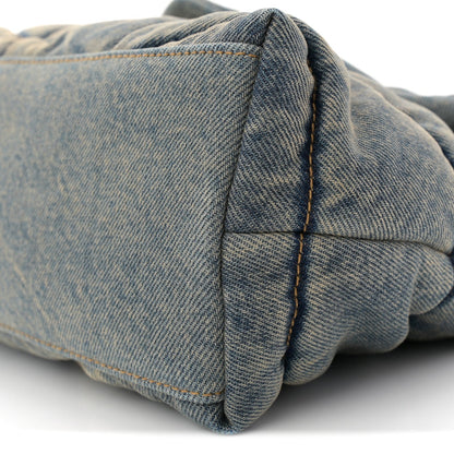Denim quilted puffer satchel back corner with fold and seam detail