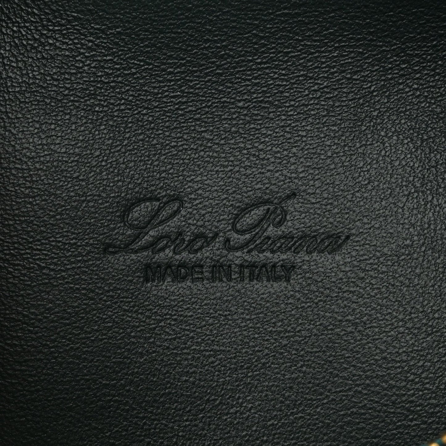 Loro Piana logo stamp on dark green grained calfskin leather pouch.