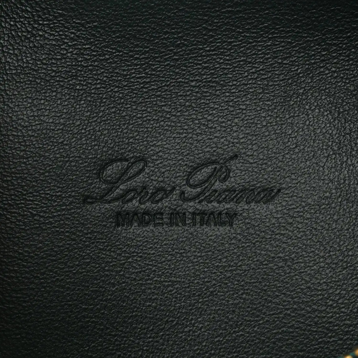 Loro Piana logo stamp on dark green grained calfskin leather pouch.