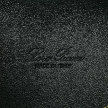 Loro Piana logo stamp on dark green grained calfskin leather pouch.