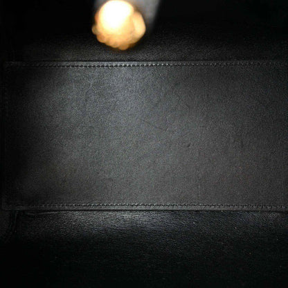 Calfskin leather panel in black with stitched seam and smooth grain texture.