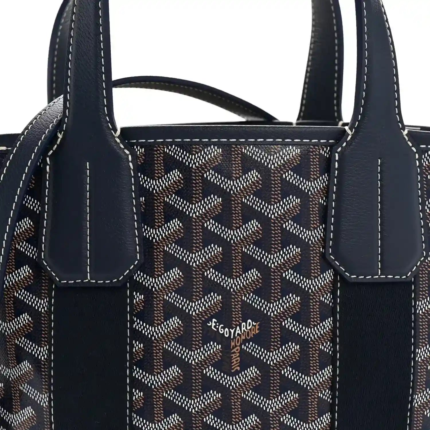 Front panel of navy patterned tote with two dark front straps