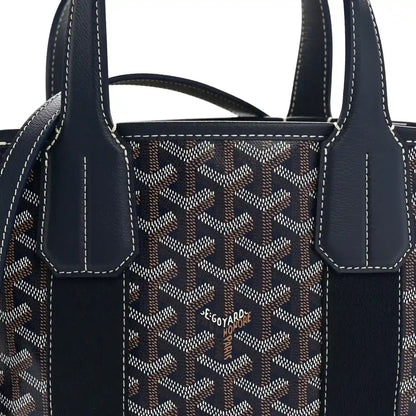 Front panel of navy patterned tote with two dark front straps