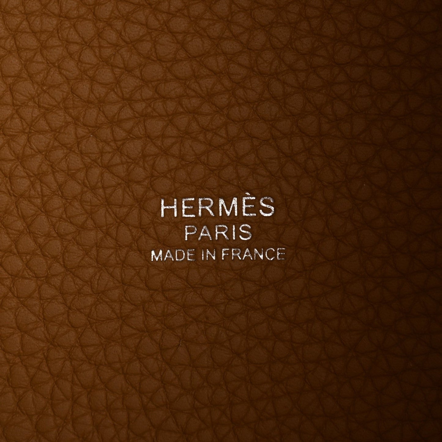 Tan leather interior with stamped HERMES PARIS MADE IN FRANCE text