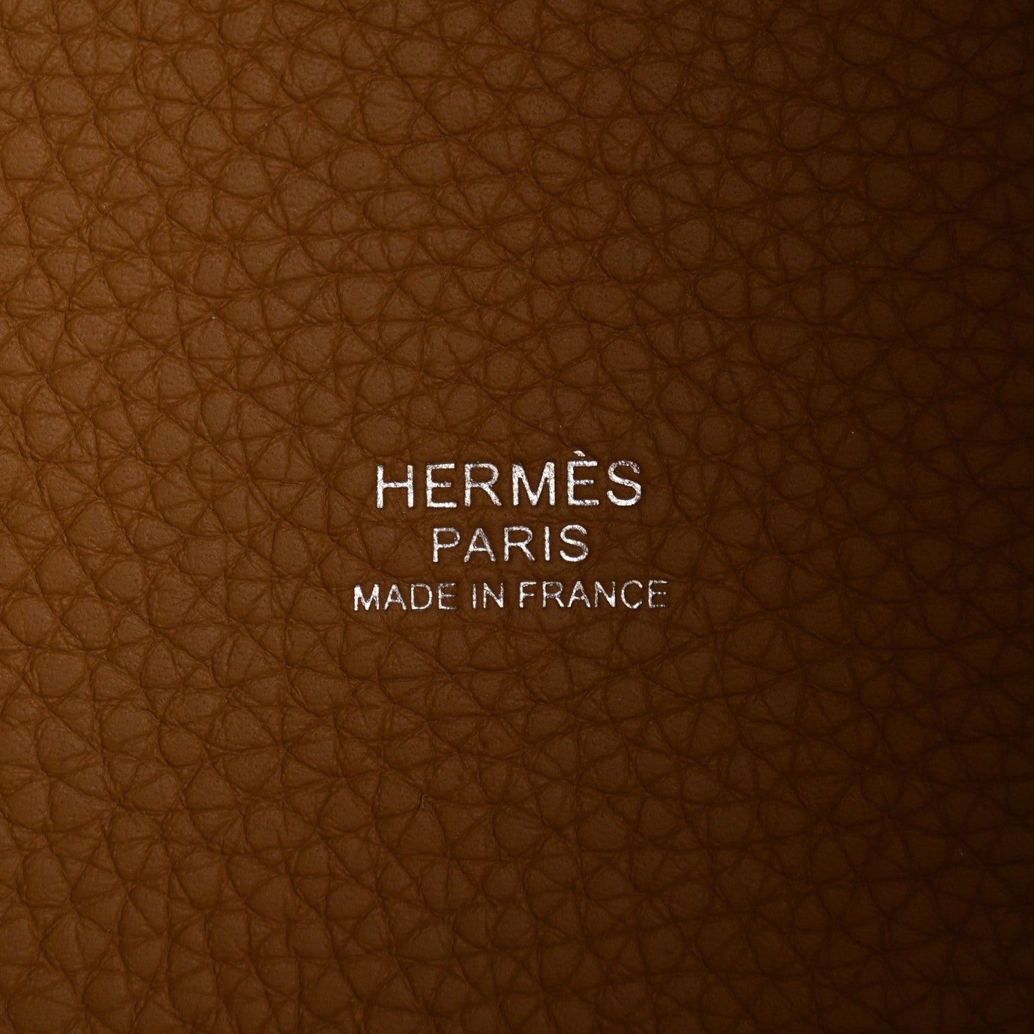 Tan leather interior with stamped HERMES PARIS MADE IN FRANCE text