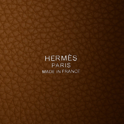Tan leather interior with stamped HERMES PARIS MADE IN FRANCE text