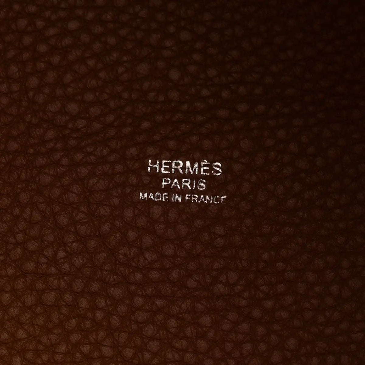 Brown leather interior lining with embossed HERMES PARIS MADE IN FRANCE