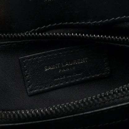 Black fabric interior tag with “SAINT LAURENT” logo inside satchel