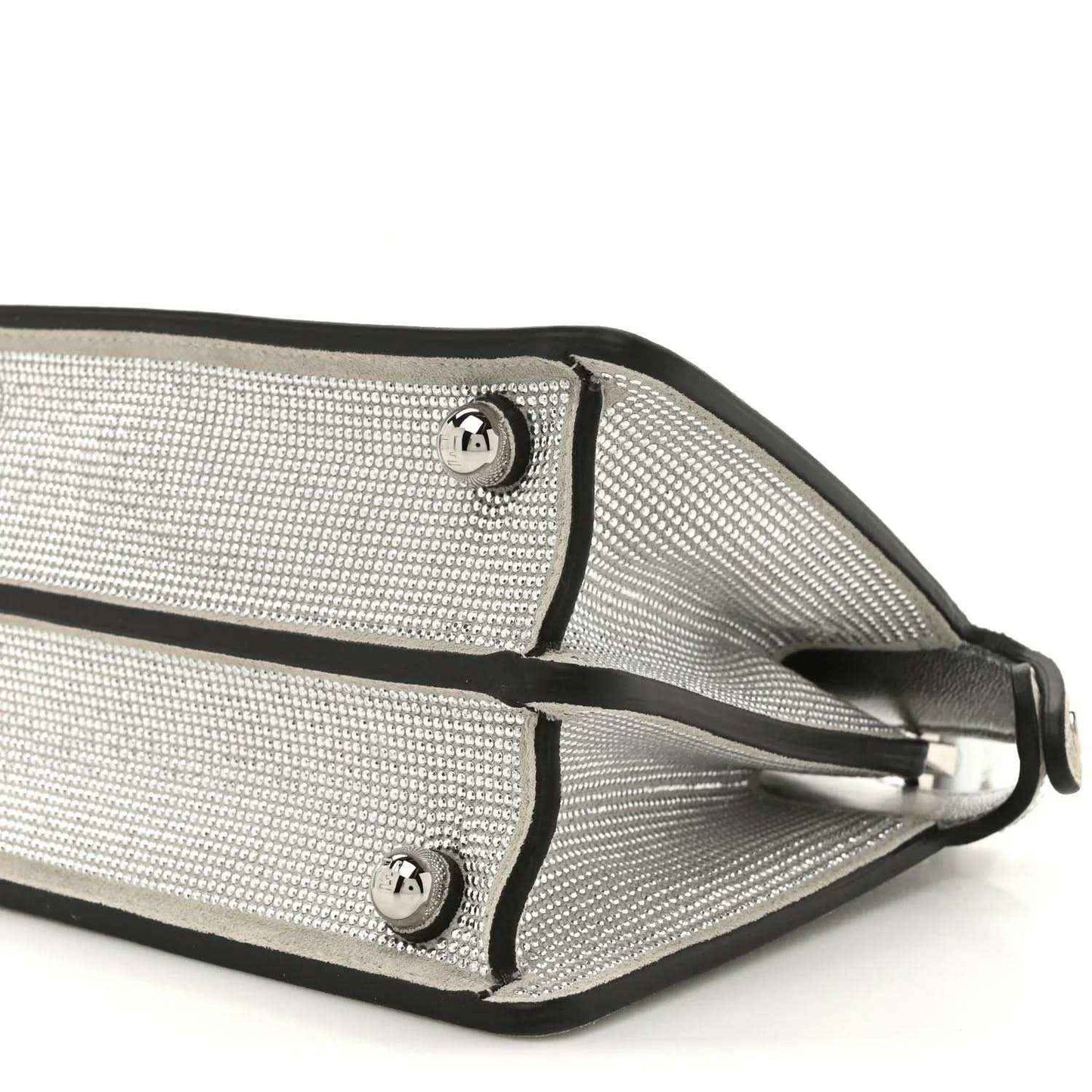 Silver crystal satchel strap attachments with metal buckles and leather trim