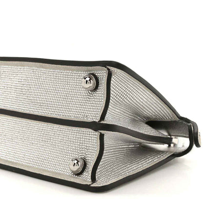 Silver crystal satchel strap attachments with metal buckles and leather trim