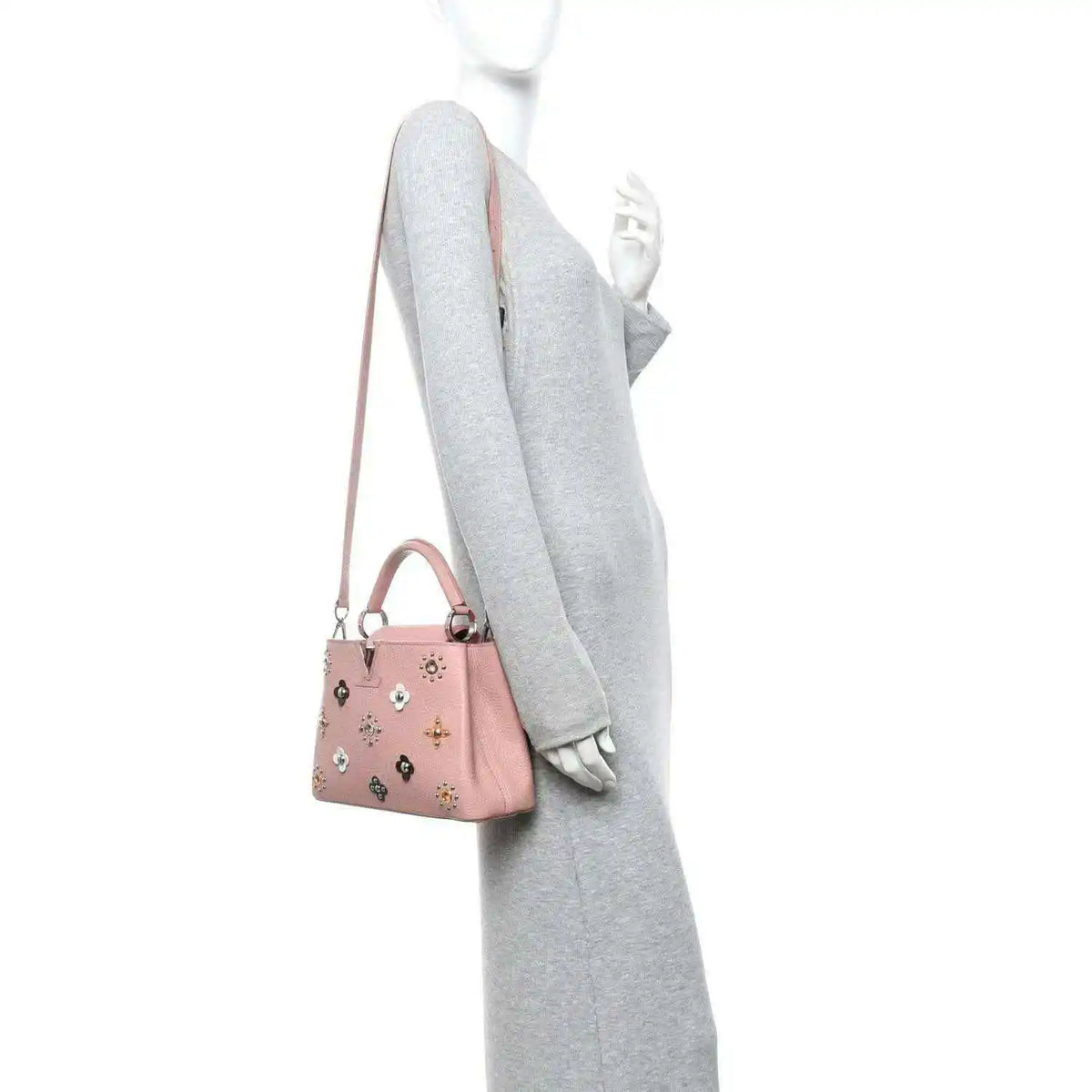 Pink mini handbag on shoulder strap with top handle and jeweled flower appliqués