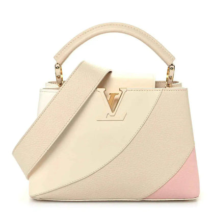 Tonal beige leather handbag with top handle, gold-tone hardware, front V emblem