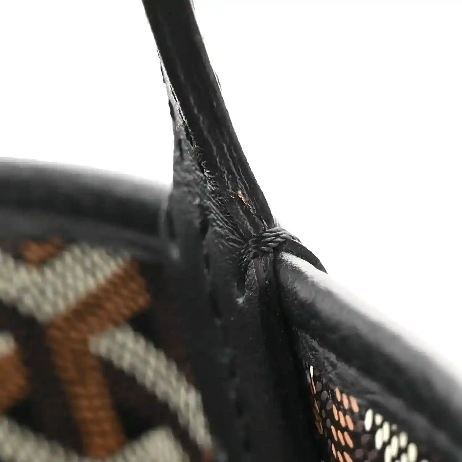 Mini Anjou reversible tote bag, close-up of black handle attachment with stitching