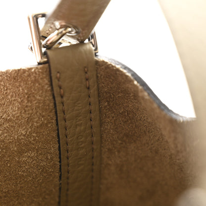 Beige leather strap attachment with stitched seam and silver-tone hardware