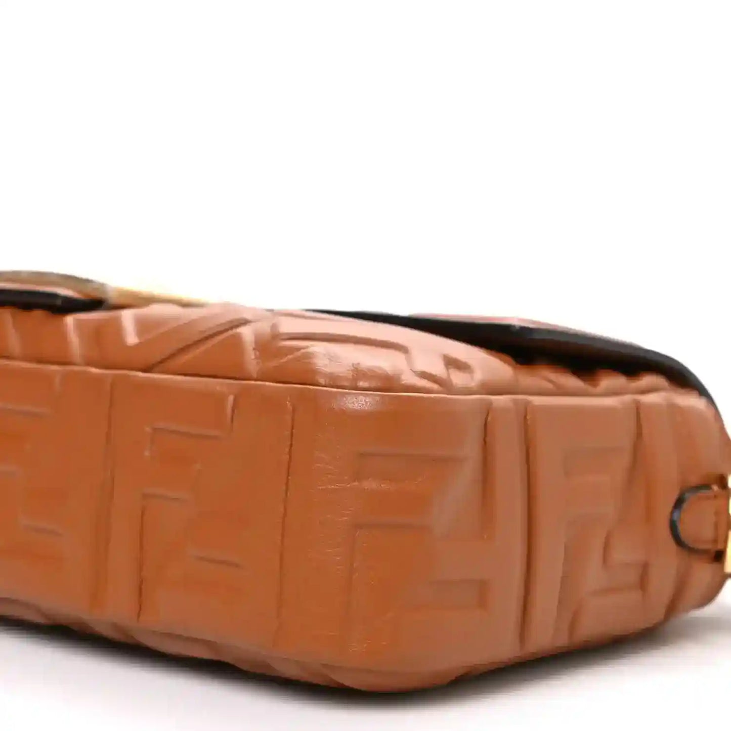Fendi baguette bag side close-up in tan embossed leather with gold-tone ring