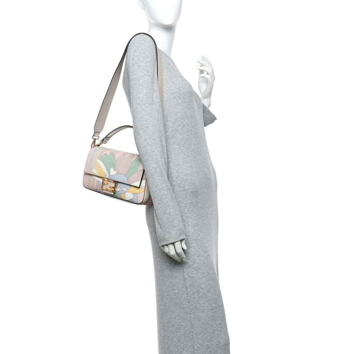 Fendi baguette handbag worn on model, multicolor floral front with shoulder strap