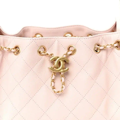 Light pink Chanel mini quilted leather handbag front opening with gold chain charm