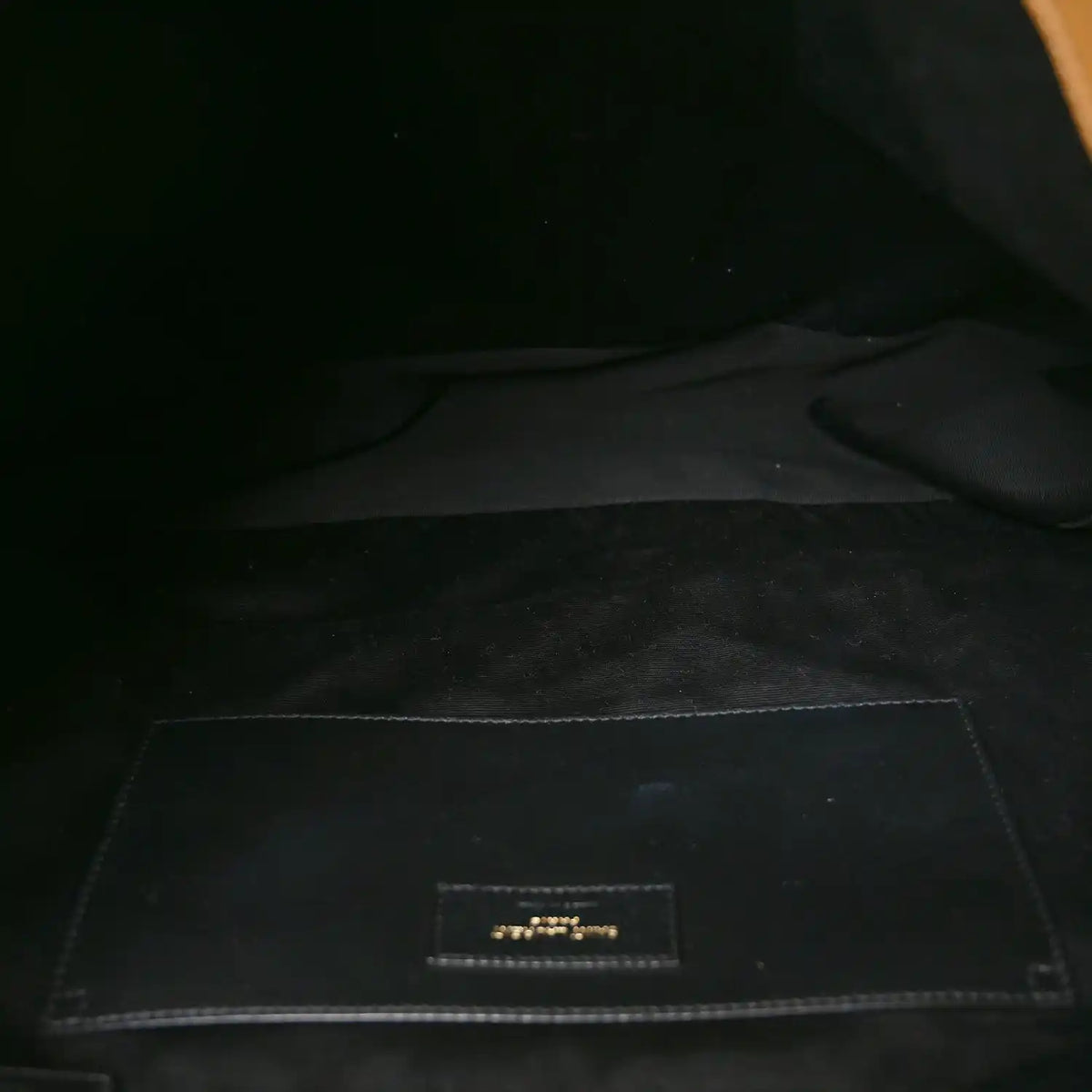 Lined interior pocket with logo label patch inside the bag