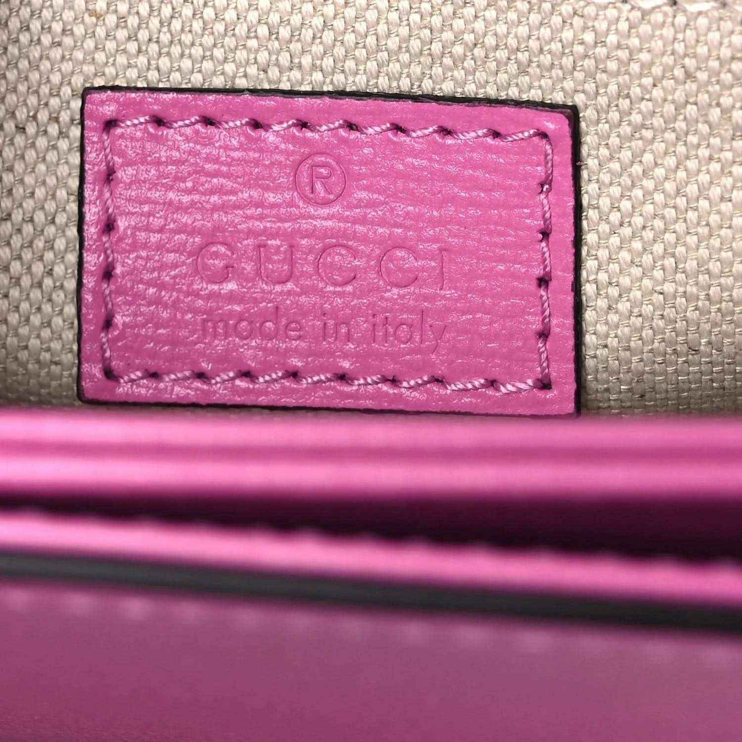 Gucci pink leather bag interior logo patch on fabric lining