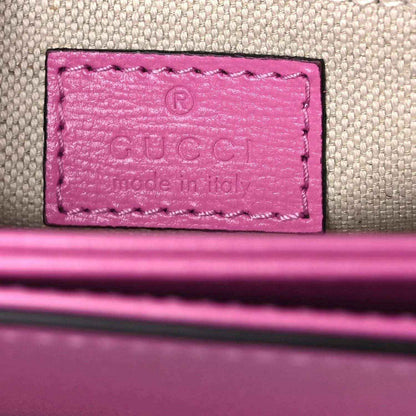 Gucci pink leather bag interior logo patch on fabric lining