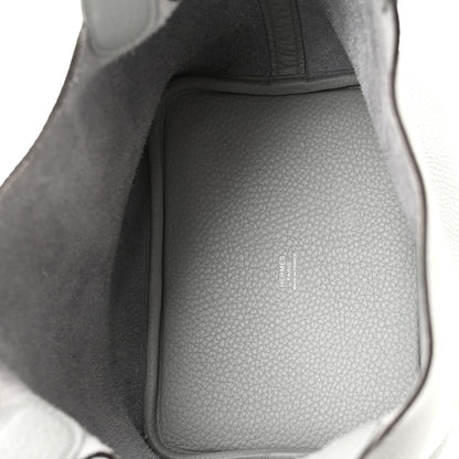 Interior view of light blue pebbled leather bucket bag with structured lining