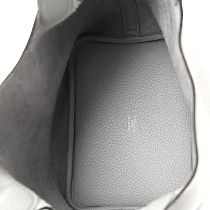 Interior view of light blue pebbled leather bucket bag with structured lining