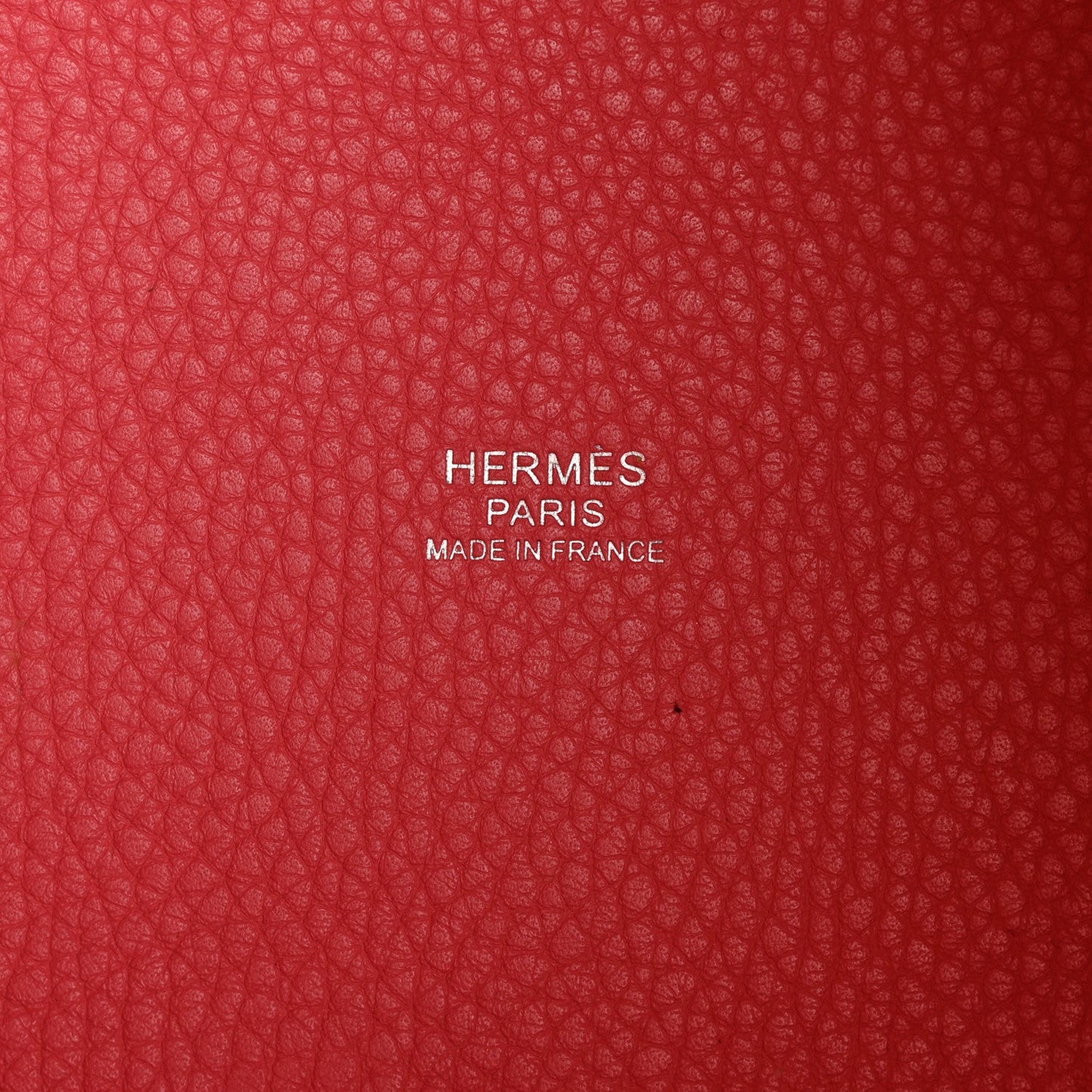 Red leather lining with embossed text: HERMES PARIS MADE IN FRANCE