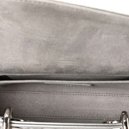 Handbag interior seam with stitched leather panel and visible zipper track detail.