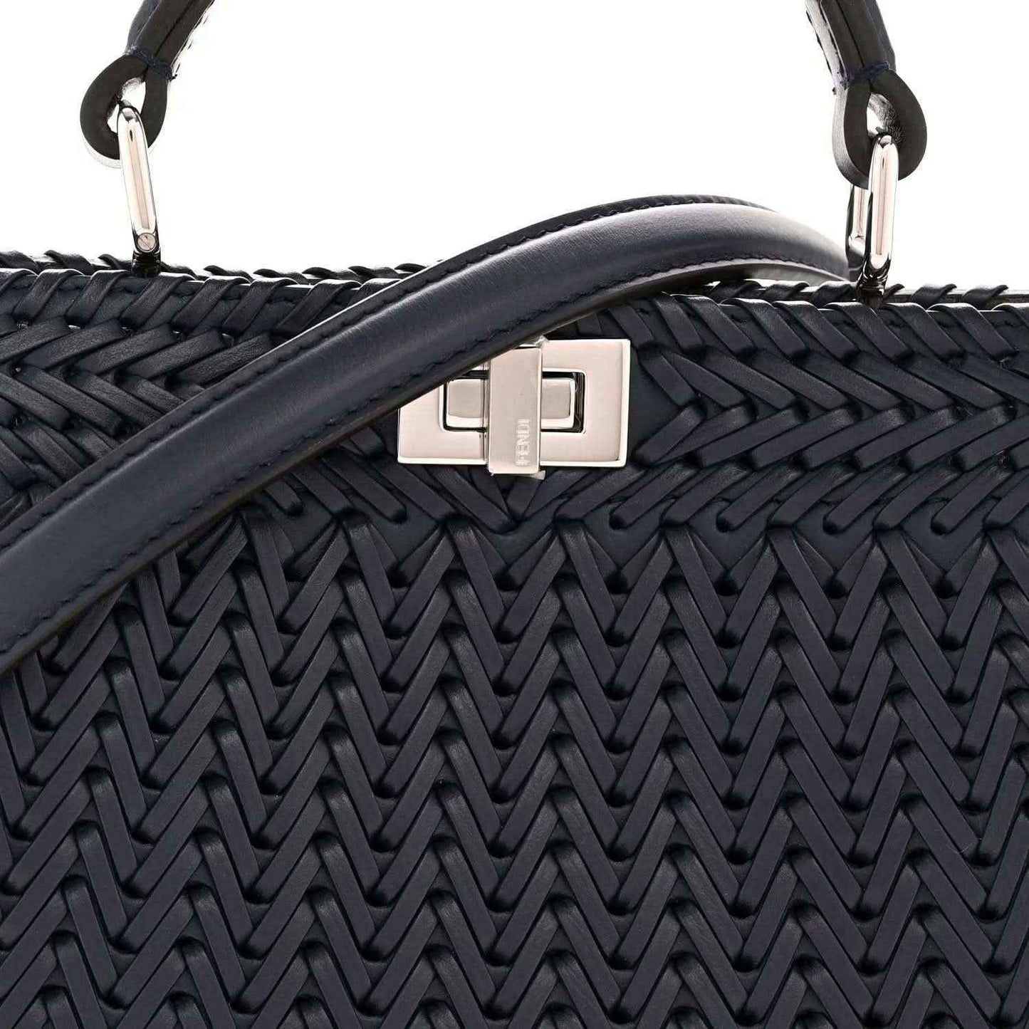 Midnight blue leather satchel with silver front clasp and woven chevron texture