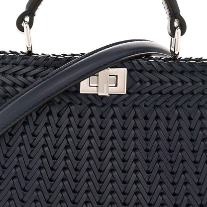 Midnight blue leather satchel with silver front clasp and woven chevron texture