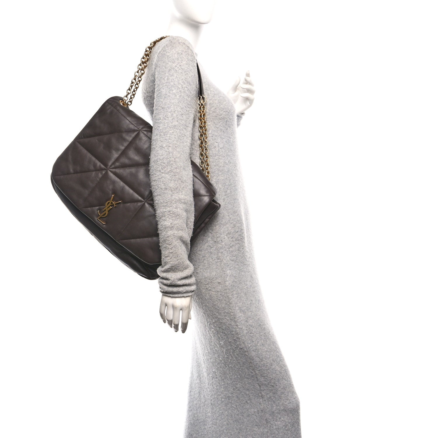 Saint Laurent quilted shoulder bag worn crossbody with gold chain strap.