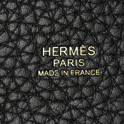 Black pebbled leather close-up with HERMES PARIS MADE IN FRANCE text