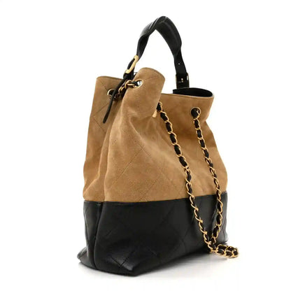 Chanel quilted shopping bag with beige suede top, black quilted bottom, chain strap