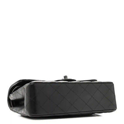 Quilted dark black leather bag side and base view with chain strap hardware
