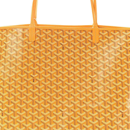 Yellow canvas tote bag with repeating Goyardine pattern and orange top edge