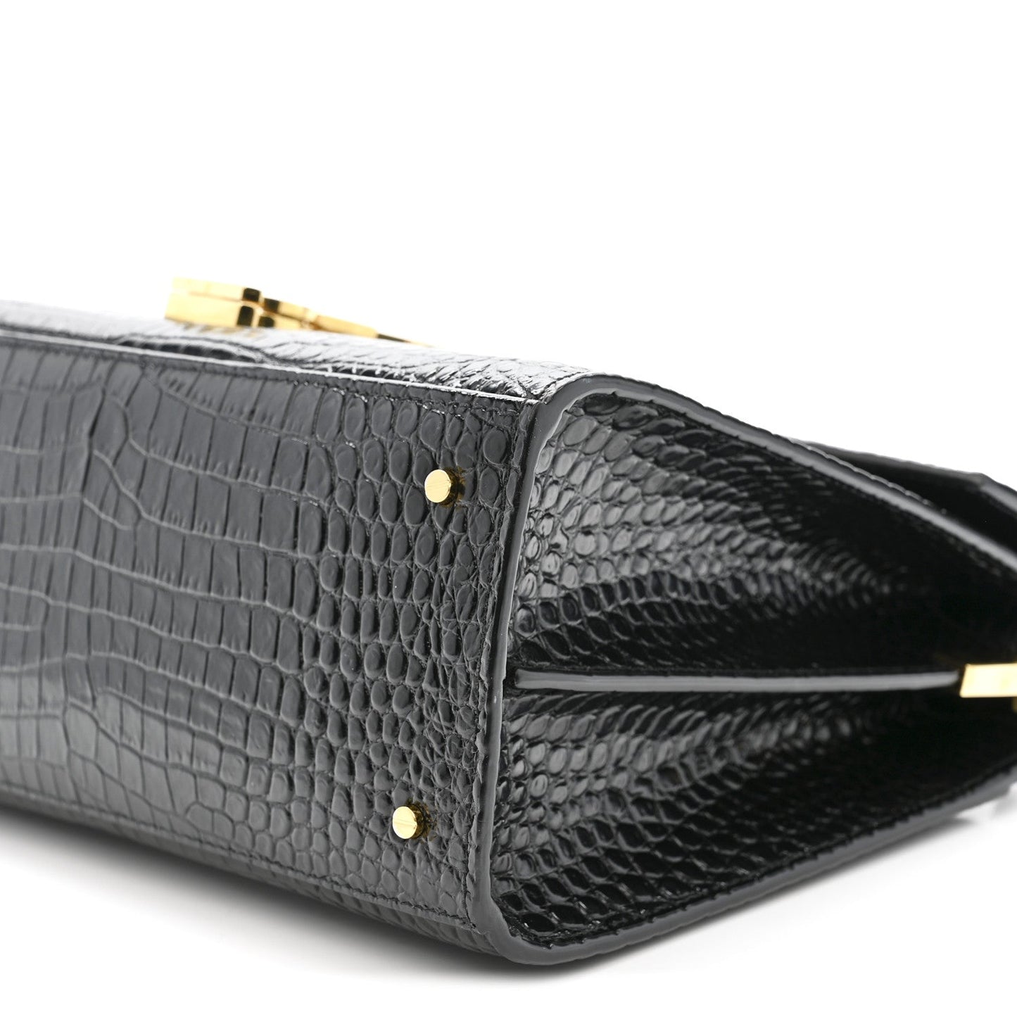 Black crocodile-embossed bag with gold rivets and crossbody strap