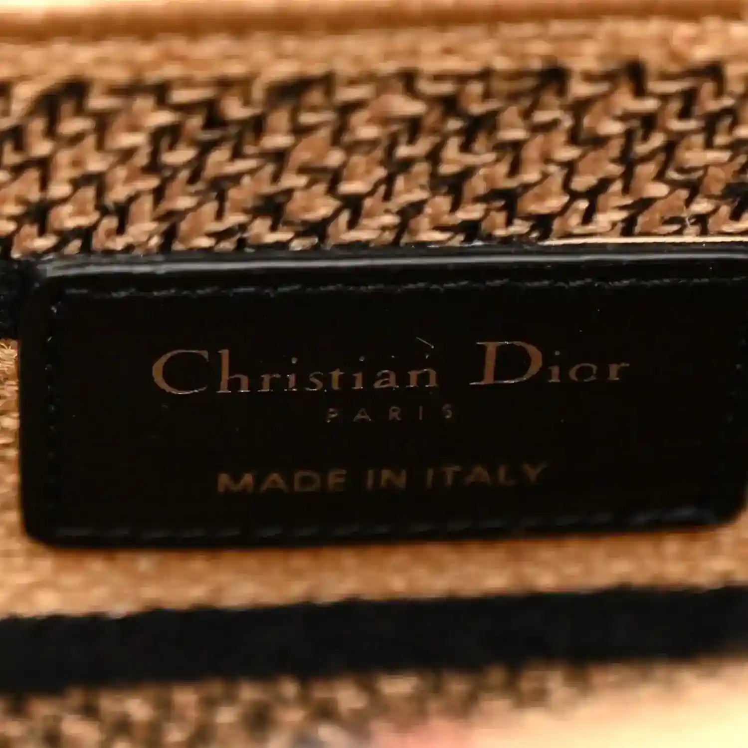 Beige jute tote bag leather logo patch reading “Christian Dior” and “Made in Italy”
