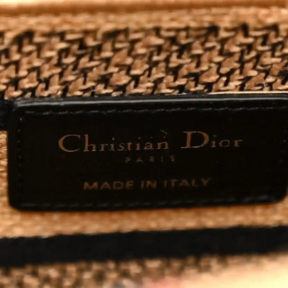Beige jute tote bag leather logo patch reading “Christian Dior” and “Made in Italy”