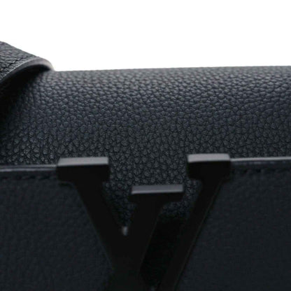 Black leather mini handbag front with raised LV emblem and textured grain.
