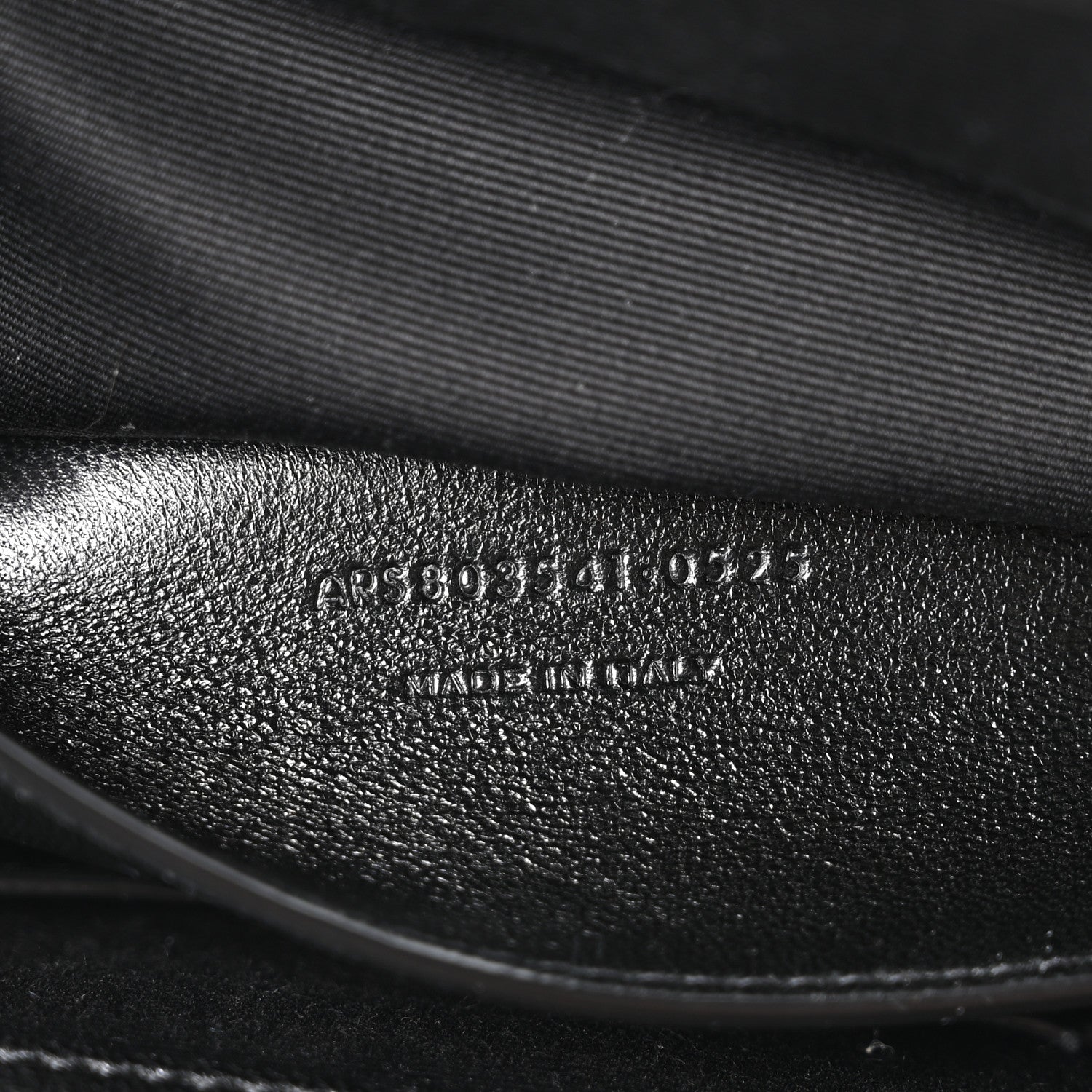 Black leather interior with embossed product code text