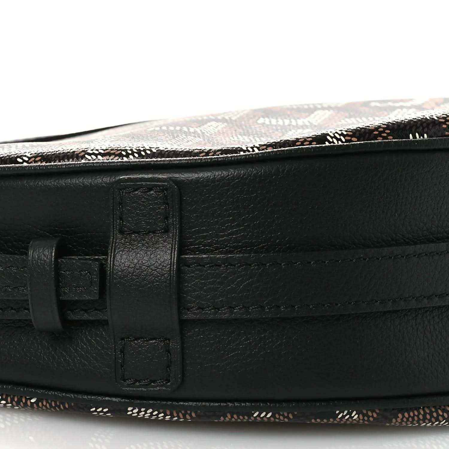 Black leather belt strap with buckle clasp on handbag