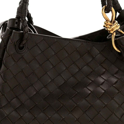 Black leather shoulder bag with intrecciato weave and gold ring clasp