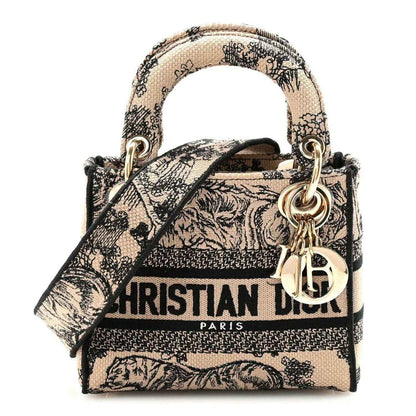 Mini Dior Lady D-Lite embroidered handbag with top handles and gold hardware, black-and-cream