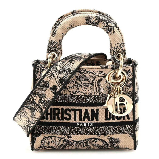 Mini Dior Lady D-Lite embroidered handbag with top handles and gold hardware, black-and-cream