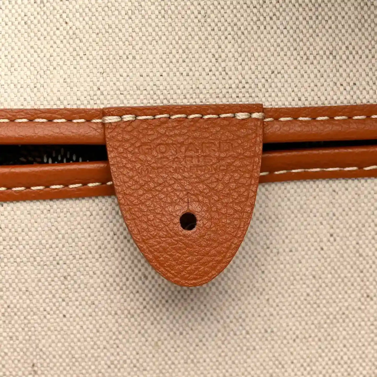 Goyard Artois GM tote bag close-up of tan leather trim and stitching on lining