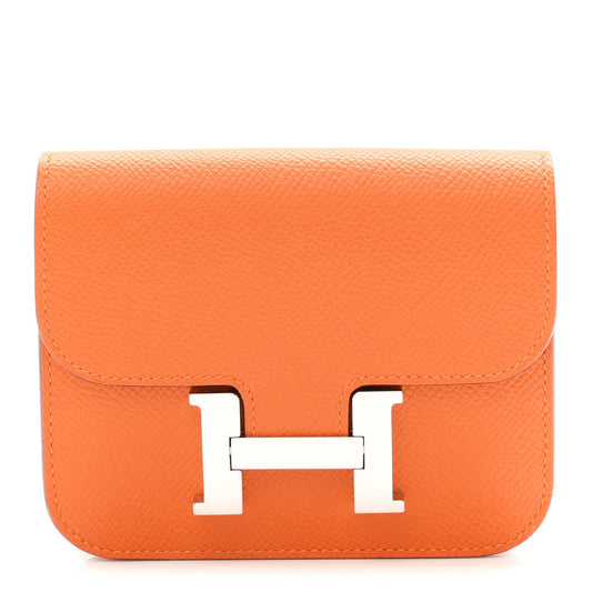 Orange Epsom leather slim wallet with H clasp front flap.